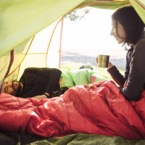 Lightweight backpacking sleeping bag inside a camping tent.